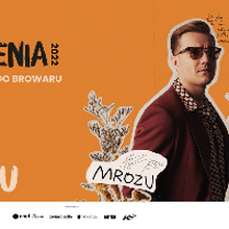 Picture of the artist among flowers on orange background.