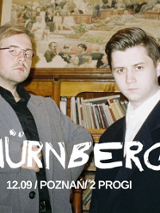 Concert poster: photo of two men and the name of the band.