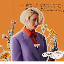 Picture of the artist on orange background among flowers