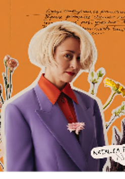 Picture of the artist on orange background among flowers