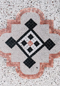 Black and grey photo of a mosaic made of small squares.