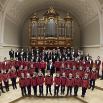 Photo of the Poznań Nightingales Boys and Men's Choir - boys and men standing on the stage of the Poznań Philharmonic