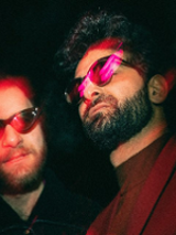 Photo of two men in sunglasses.