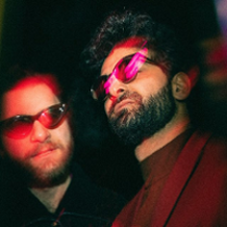 Photo of two men in sunglasses.