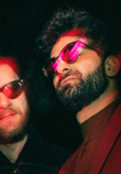 Photo of two men in sunglasses.