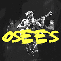 Concert poster - yellow inscription - the name of the band on black and white photo of a man with a guitar