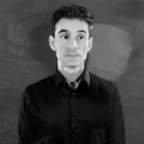 Black and white photo of the artist