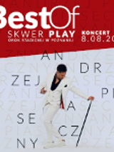 Poster of the event - photo of Andrzej Piaseczny in white suit on light grey background. On the top - red stripe with white captions on it with information about the concert