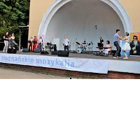 Photo of a Concert Shell in Wilson Park with artists performing on stage.