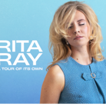 Photo of Rita Ray - a blonde woman with closed eyes.