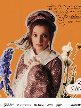 Picture of the artist on orange background among flowers