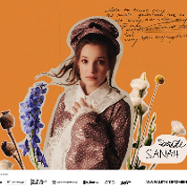 Picture of the artist on orange background among flowers