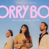 Photo of the band Sorry Boys - two men and a woman; blue sky as a background.