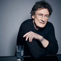 Photo of the conductor, Jacek Kaspszyk.