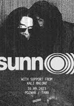 Black and white concert poster with information about the event and photo of two people dressed in black clothes.