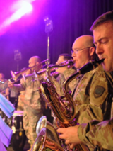 Photo of soldiers - musicians playing their instruments.