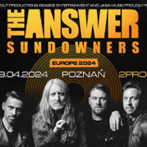 Concert poster: black and white photo of the band and orange text - information about the event.