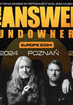 Concert poster: black and white photo of the band and orange text - information about the event.
