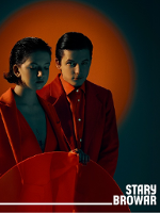 Photo of young woman and man dressed in red clothes. Red background