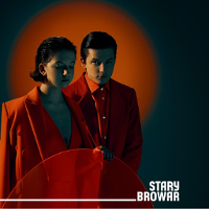 Photo of young woman and man dressed in red clothes. Red background