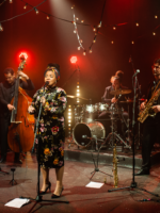 Photo of a band performing on stage