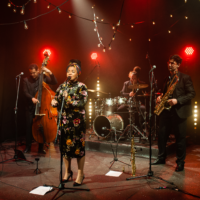 Photo of a band performing on stage