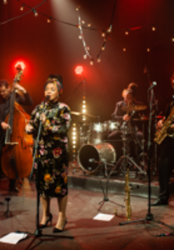Photo of a band performing on stage