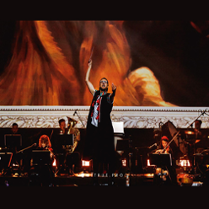 A conductor conducting an orchestra.