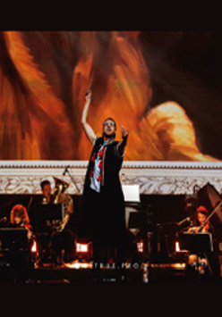 A conductor conducting an orchestra.