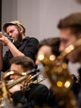 Picture of a few people playing instruments