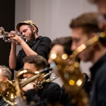 Picture of a few people playing instruments