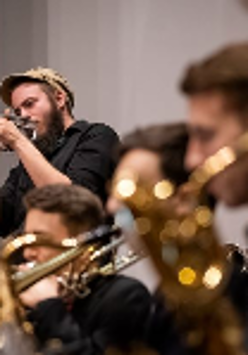 Picture of a few people playing instruments