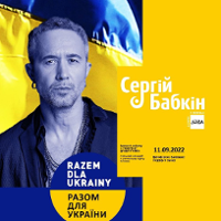 Concert poster: photo of the artist in yellow and blue colours and information about the event.