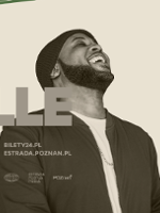 Black and white photo of Tony Momrelle, smiling, with his face up.