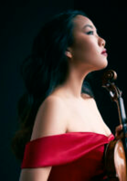 Photo of the artist - Stella Chen holding a violin in her hand