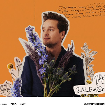 Picture of the artist among flowers on orange background.