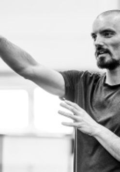 Black and white photo of Maciej Kuźmiński