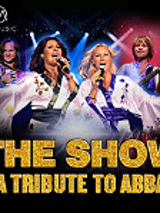 Picture of the Abba band - two women in white clothes singing to the microphones, and two men behind them. At the bottom of the poster - the title of the concert.