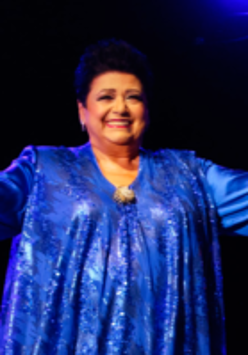 Photo of the singer - a woman in blue dress