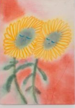 Picture of two yellow flowers with faces