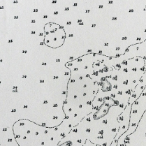 Black and white picture - various numbers, some of them linked with various lines.