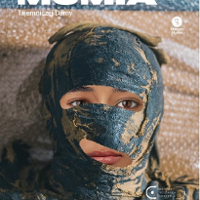 Photo of woman's face partly covered with dark cloth.