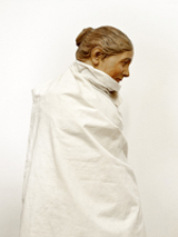 One of the exhibition works: photo of a woman wrapped in white cloth.