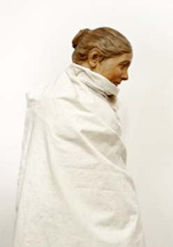 One of the exhibition works: photo of a woman wrapped in white cloth.