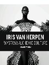 An Afro-American woman wearing a white and black dress. In the middle - black stripe with white lettering