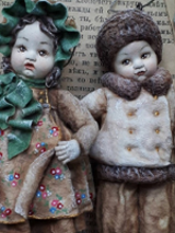 Photo of two dolls.