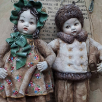 Photo of two dolls.