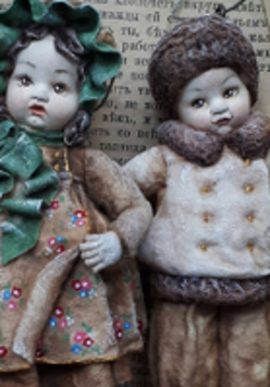 Photo of two dolls.