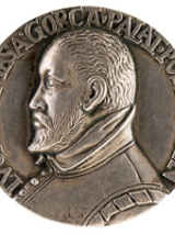One of the exhibits: a silver medal with man's face in profile.