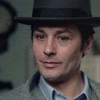 Photo of a man in a bowler hat.